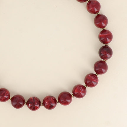 Collier sur câble - perles boules en résine