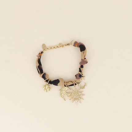 Bracelet - ruban, tissu et breloques (soleil, oiseau, lune, étoile, trèfle)