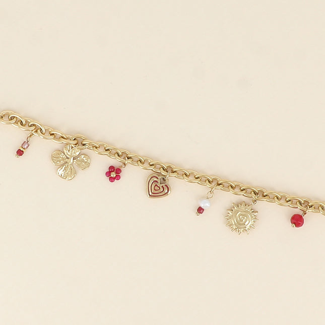 Bracelet - breloques soleil, coeur, trèfle et perles