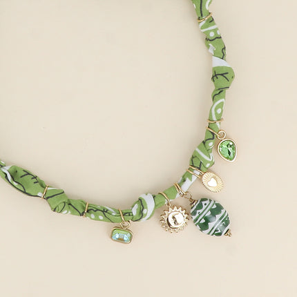 Collier - ruban, tissu, breloques cristaux, soleil, coeur, perle en céramique émaillée
