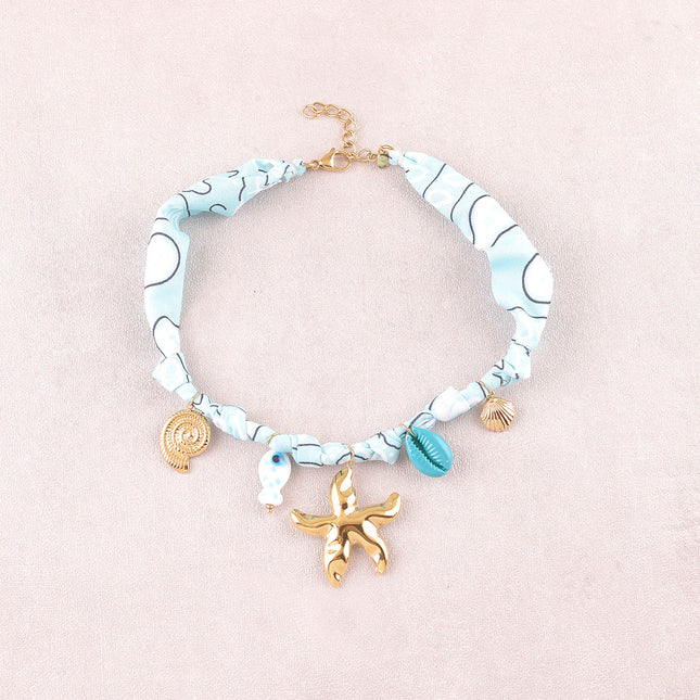 Collier - coquillages, cauri en émail, poisson en céramique, soleil et étoile de mer