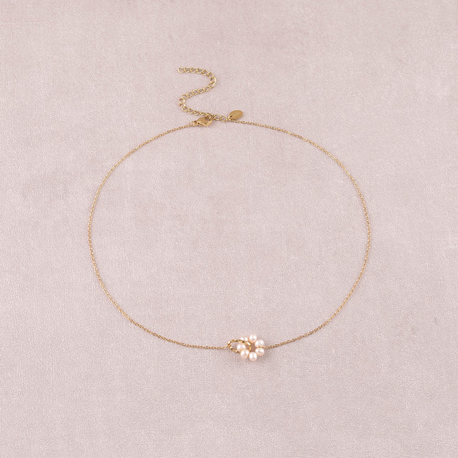 Collier - anneau torsadé et perles d'eau douce