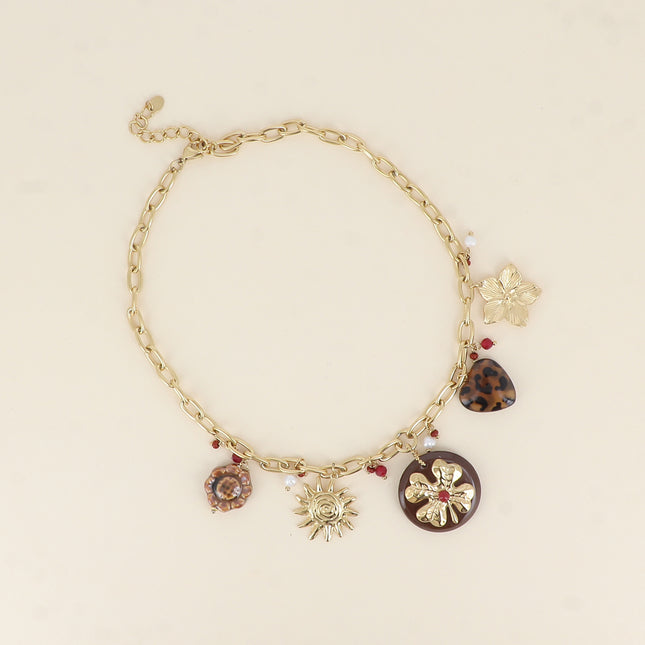Collier - fleur en céramique émaillée, soleil, trèfle sur pièce ronde en résine, coeur léopard, fleur