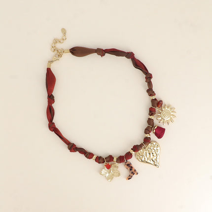 Collier Néor - fleur, pierre naturelle, coeur, soleil, rose ruban, botte en résine