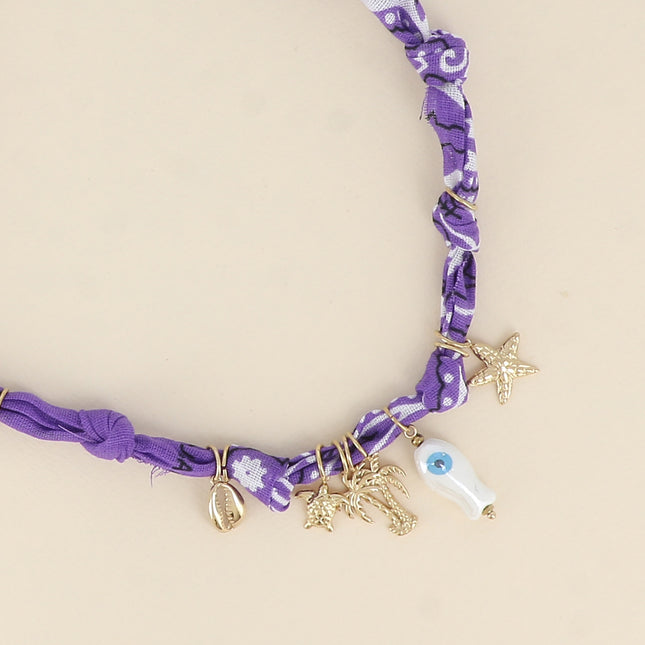 Collier - cauri, tortue, palmiers, poisson en céramique, étoile de mer