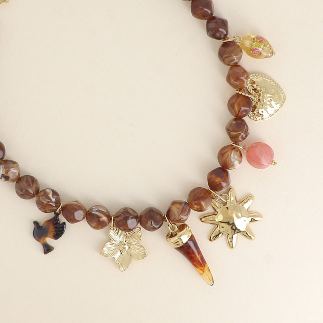 Théa Necklace - flower, resin horn, sun, resin beads, heart
