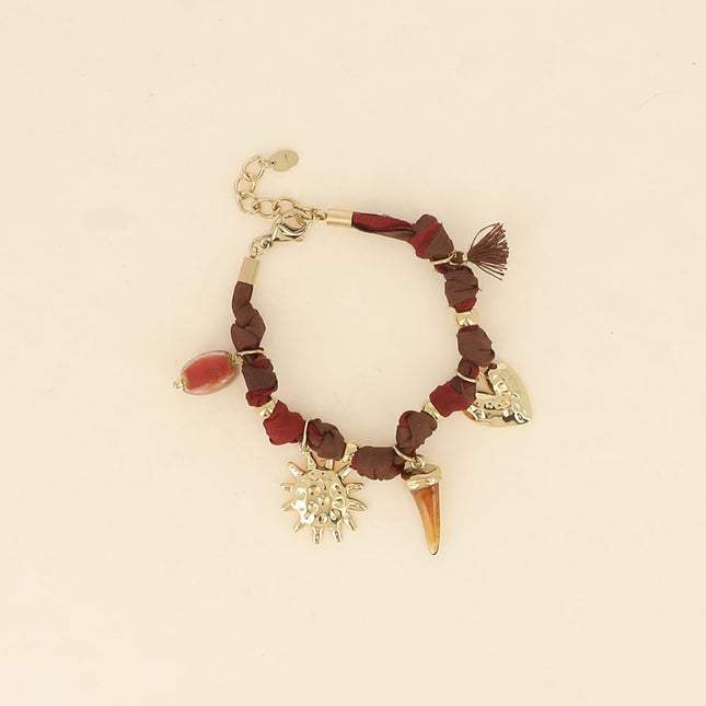 Bracelet - ribbon fabric, enameled ceramic bead, sun, resin horn, textured heart