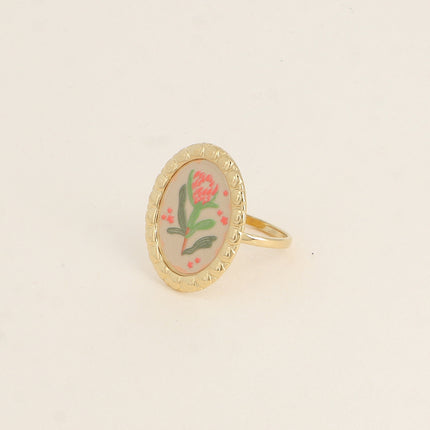 Bague - médaillon avec une fleur émaillée