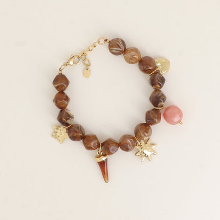 Bracelet Théa - fleur, corne en résine, soleil, perles en résine, coeur