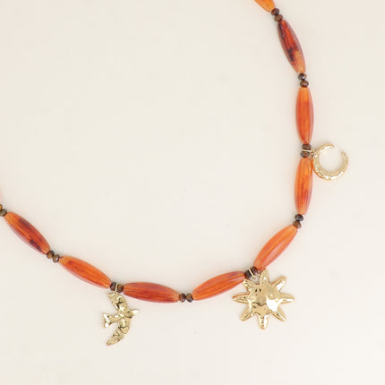 Collier sur câble - perles en résine, lune, oiseau, soleil