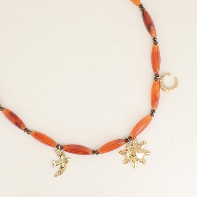 Collier sur câble - perles en résine, lune, oiseau, soleil