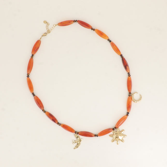 Collier sur câble - perles en résine, lune, oiseau, soleil