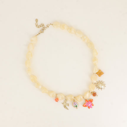 Dune Necklace - on wire, resin beads, bird, ceramic bead, orchid flower, sun