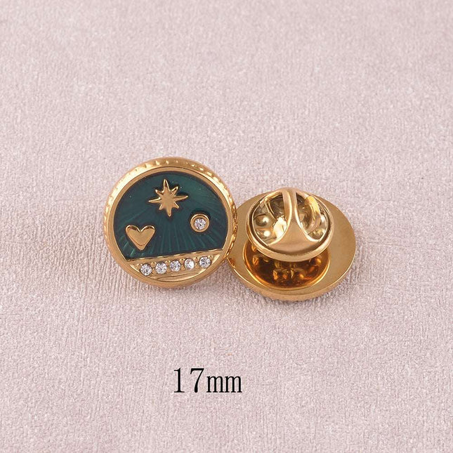 Pin's - pièce ronde avec coeur, étoile du Nord et cristaux sur fond d'émail
