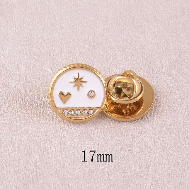 Pin's - pièce ronde avec coeur, étoile du Nord et cristaux sur fond d'émail