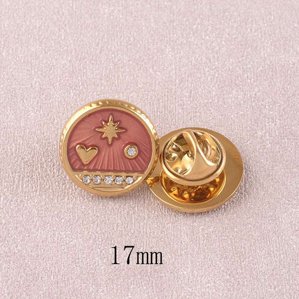 Pin's - pièce ronde avec coeur, étoile du Nord et cristaux sur fond d'émail