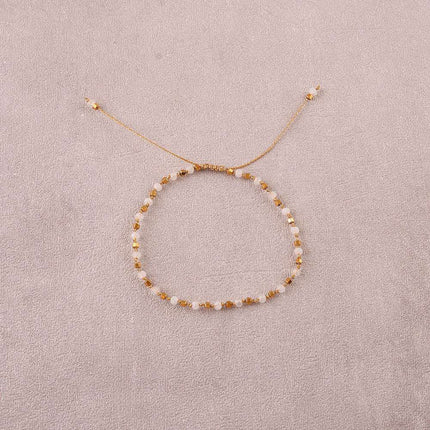 Bracelet - sur fil, fermoir coulissant, fils noués, de perles carrées en acier inoxydable et de pierres naturelles taillées