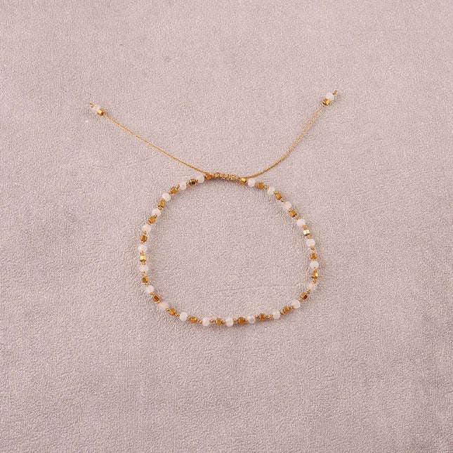 Bracelet - sur fil, fermoir coulissant, fils noués, de perles carrées en acier inoxydable et de pierres naturelles taillées