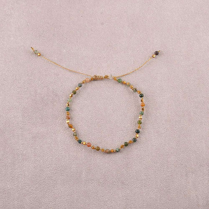 Bracelet - sur fil, fermoir coulissant, fils noués, de perles carrées en acier inoxydable et de pierres naturelles taillées