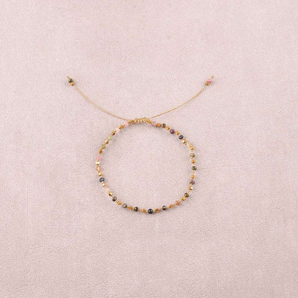 Bracelet - sur fil, fermoir coulissant, fils noués, de perles carrées en acier inoxydable et de pierres naturelles taillées