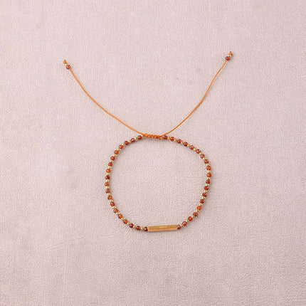 Bracelet - sur fil, fermoir coulissant, tube rectangulaire embelli par des messages "Paix, Liberté, Amour, Carpediem" en acier inoxydable et pierres naturelles
