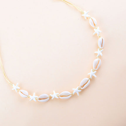 Collier - fermoir coulissant, sur cordon, petites étoiles de mer en résine et cauris naturels