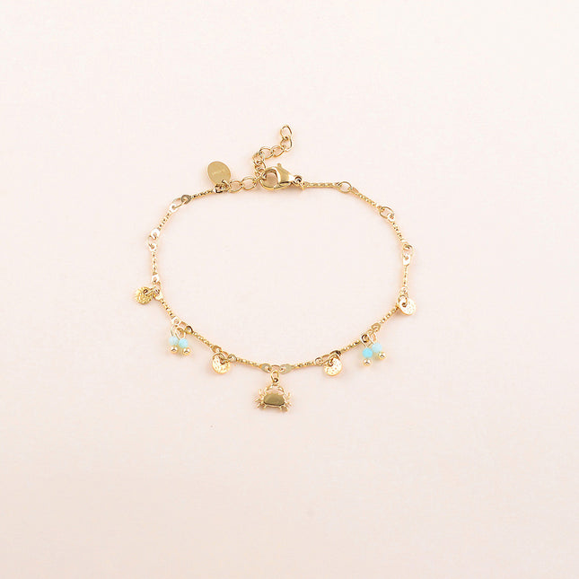 Bracelet - pastilles rondes martelées, pâtes de verre et pendentif crabe