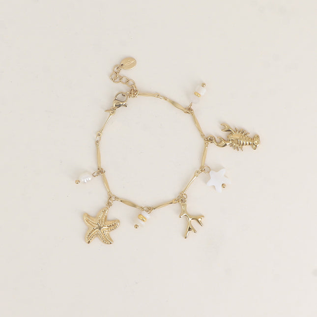 Bracelet - breloques (coquillages, corail, cauri naturel, étoile de mer et poisson en céramique émaillé, étoile de mer)