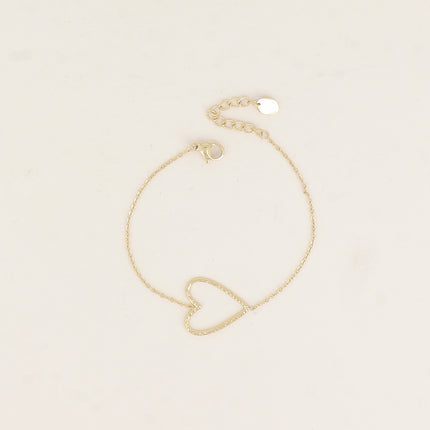 Bracelet - pendentif en forme de coeur ajouré