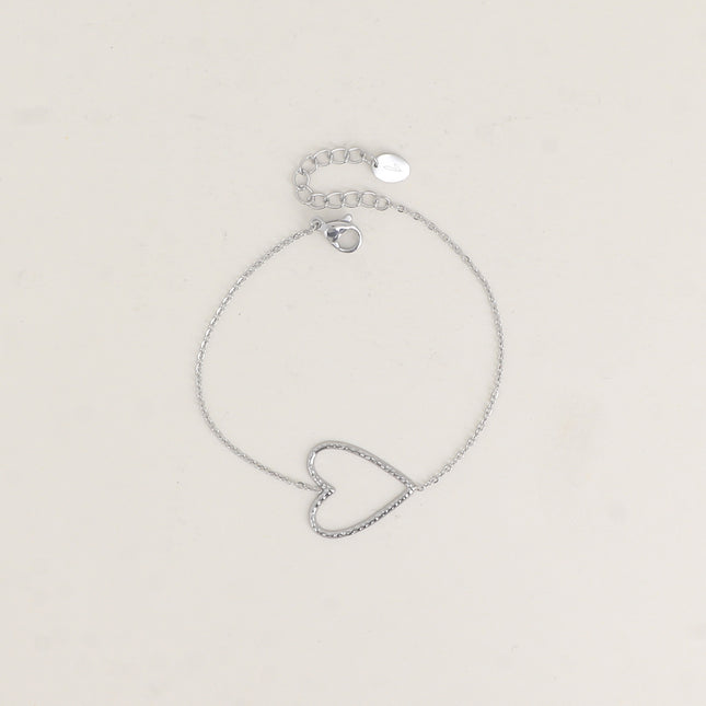 Bracelet - pendentif en forme de coeur ajouré