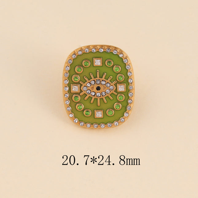 Pin's - médaillon rectangulaire émaillé, oeil avec cristaux