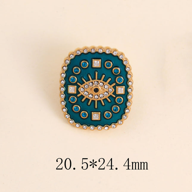 Pin's - médaillon rectangulaire émaillé, oeil avec cristaux