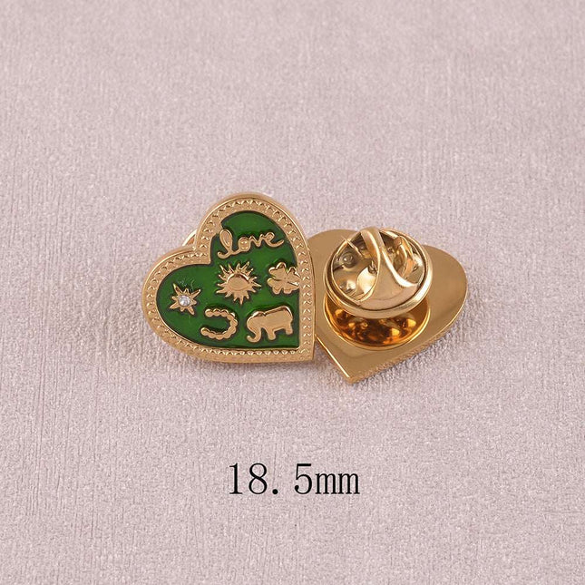 Pin's - motif coeur, divers symboles (étoile, love, fer à cheval, soleil, trèfle, éléphant) sur fond d'émail