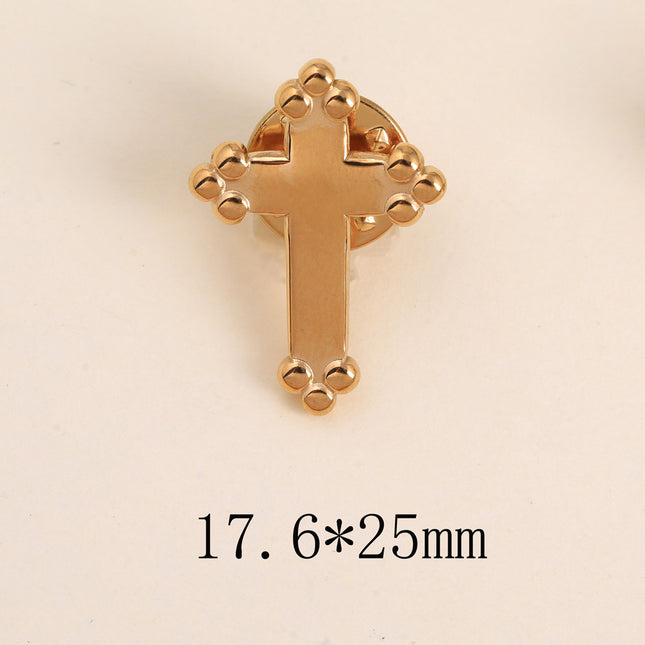 Pin's - croix religieuse à finition perlée