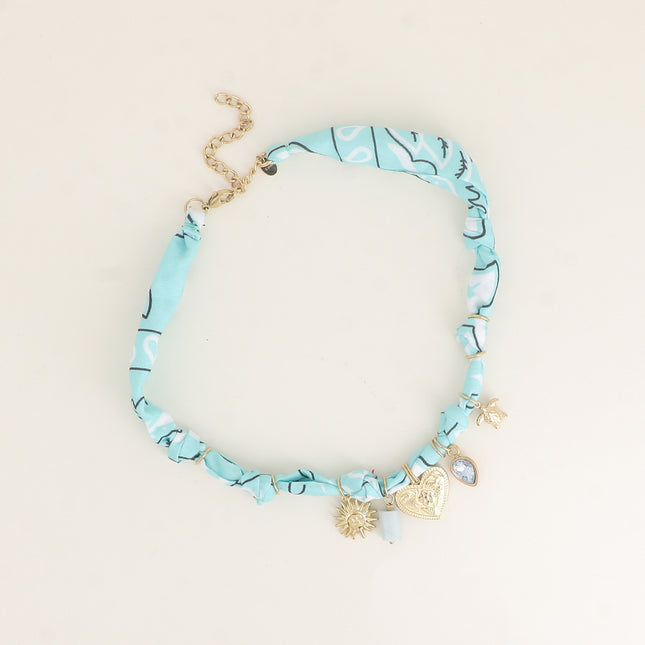 Collier sur tissu ruban - soleil, pierre naturelle, coeur avec gravures, cristal et tortue