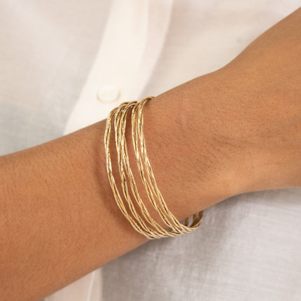 Cuff - 5 twisted and grooved rings
