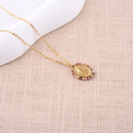 Collier - médaillon ovale croix religieuse et pierres naturelles