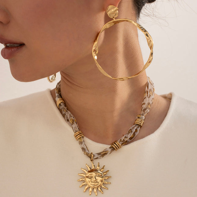 Delphina Necklace - fabric, steel rings and smiling sun pendant