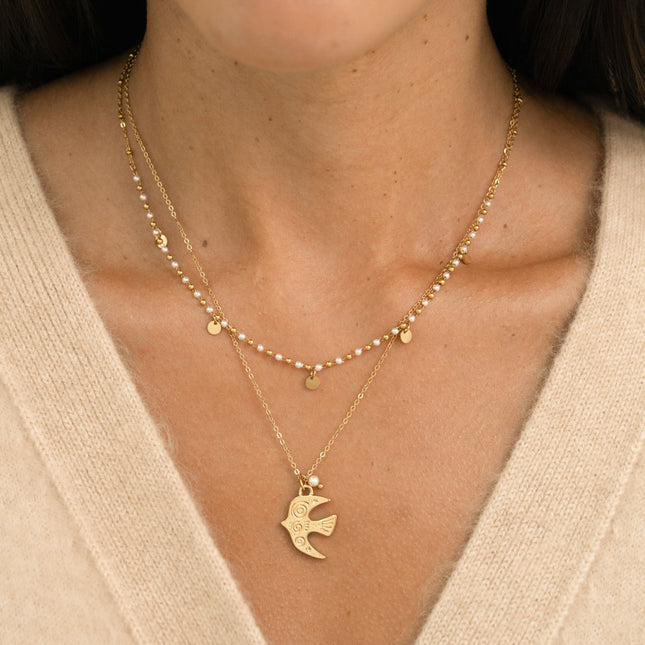 Collier 2 rangs - pendentif en forme d'oiseau, perles de résine blanche