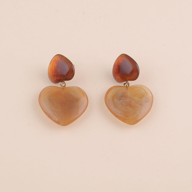 Boucles pendantes - deux coeurs en résine