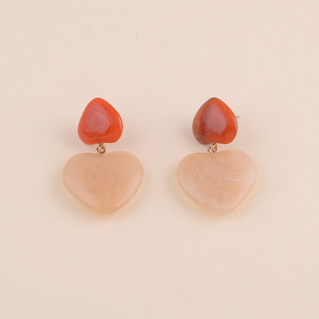 Boucles pendantes - deux coeurs en résine