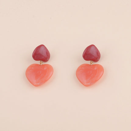 Boucles pendantes - deux coeurs en résine