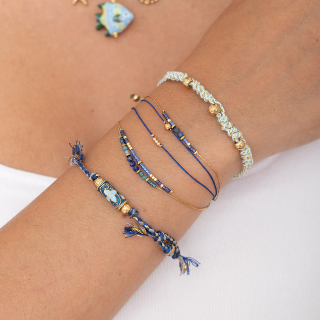Sliding bracelet on cord - braided pattern and steel beads