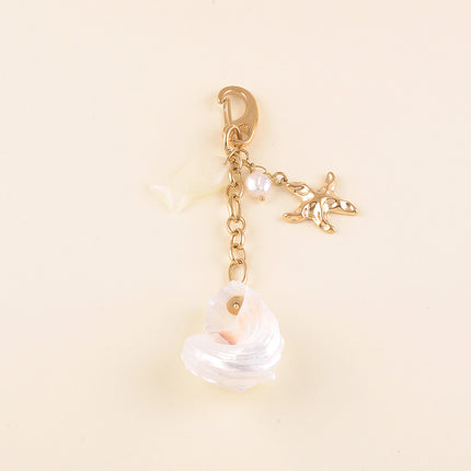Porte-clé - coquillage naturel, étoile de mer, poisson en résine et perle d'eau douce