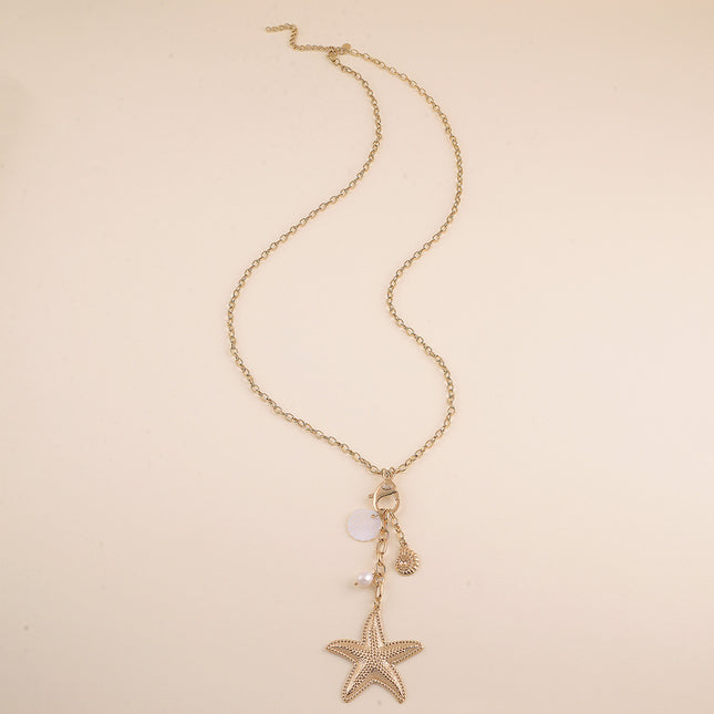 Sautoir - fermoir mousqueton, étoile de mer, coquillae nacré, perle d'eau douce et coquillage