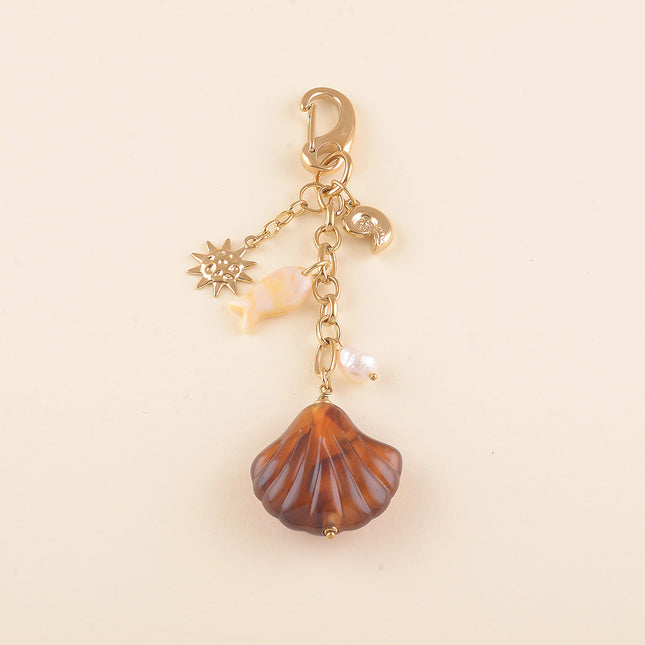 Porte-clé - coquillage en résine, poisson en résine, coquillage escargot, soleil martelé et perle d'eau douce