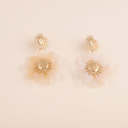 Boucles pendantes - soleil martelé et fleur en résine