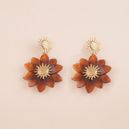 Boucles pendantes - soleil martelé et fleur en résine
