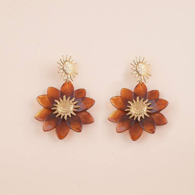 Boucles pendantes - soleil martelé et fleur en résine