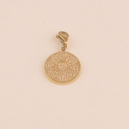 Charm - médaillon rond, soleil et étoiles